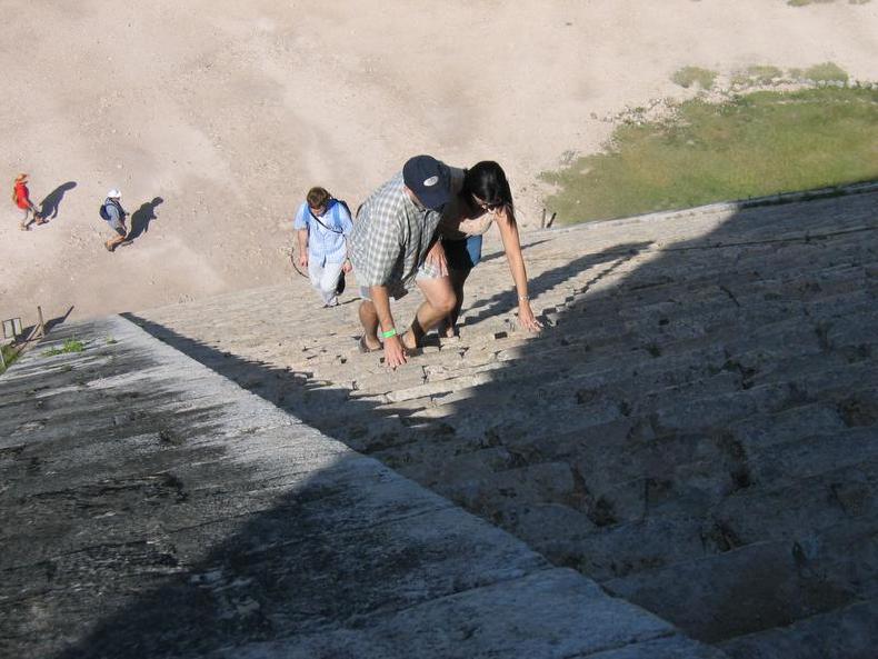 People climbing up the step-pyramid